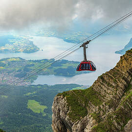 Cable car to Mount Pilatus in Switzerland, with Lake Lucerne in the background by Miroslav Liska
