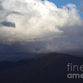 Clouds Over Mountain Peak by Joy Watson
