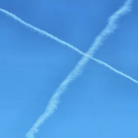 Contrails in Blue sky by Roberta Byram