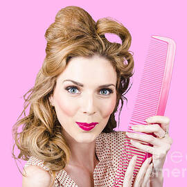 Cute retro female hairdresser with big hair comb
