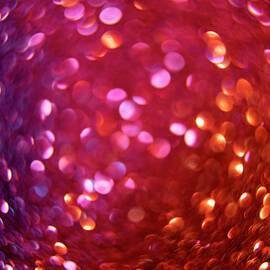 Defocused bubble bokeh abstract background. Circular bokeh of dark, red glitter  by Dorin Puha
