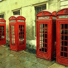 Diagonal line up of five iconic English telephone booths  by Eckart Mayer Photography