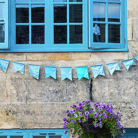 Flowers and Bunting on a Cottage in Winchcombe by Tim Gainey