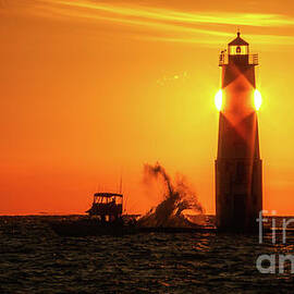 Frankfort Lighthouse Sunset boat and wave by Todd Bielby