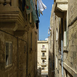 Gallivanting Around Valletta Malta - Charming Narrow Street with Drying Laundry by Georgia Mizuleva
