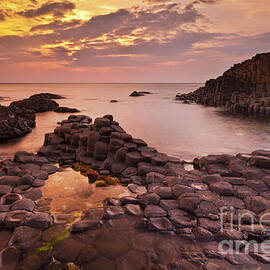 Giants Causeway sunset, County Antrim, Northern Ireland, UK by Neale And Judith Clark