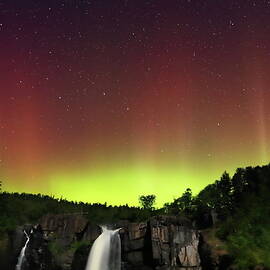 Grand Portage waterfall with Aurora Borealis by Alex Nikitsin