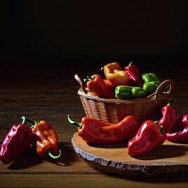 Harvest Palette Peppers on a Wooden Table by Gary Williams