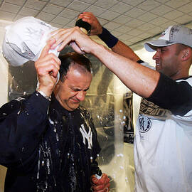 Joe Torre and Derek Jeter by Ezra Shaw