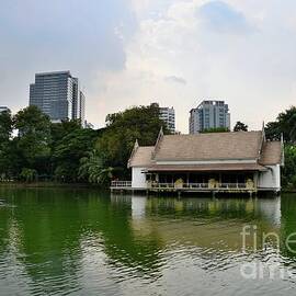 Lake and house with skyline at Lumphini Park Bangkok Thailand by Imran Ahmed