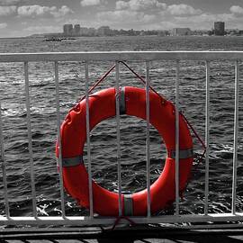 Lifebuoy on a pier in Mamaia, Romania - black and white with isolated color by Nicko Prints