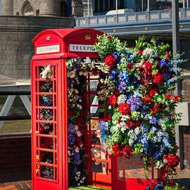 London Red Telephone Box with Floral Display near Tower Bridge - Fine Art British Icon Photography by Raymond Hill