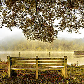 Lone Bench at the Autumn Lake by Debra and Dave Vanderlaan