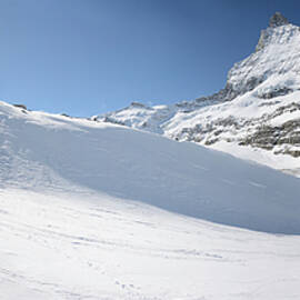 Matterhorn and skier  by Alberto Aristeguieta