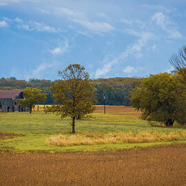 Metal Barn sitting in the Missouri Countryside  by George Strohl
