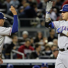 Michael Young and Josh Hamilton by Al Bello