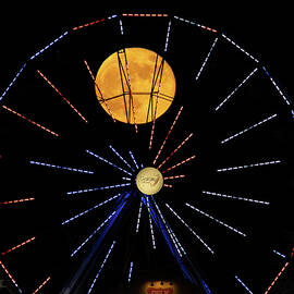 Moon behind Gallaxy wheel by Tran Boelsterli