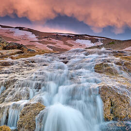 Mountain waterfall and mammatus clouds at sunset. Thaw. Sierra Nevada National park..  by Guido Montanes Castillo