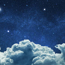 Night sky with clouds and stars by Julien