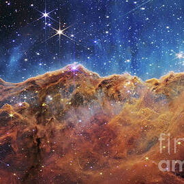 NIRCAM IMAGE OF THE COSMIC CLIFFS IN CARINA, JAMES WEBB SPACE TELESCOPE by NASA