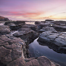 Ocean Beach Rock Formations and Colorful Sunset by William Dunigan