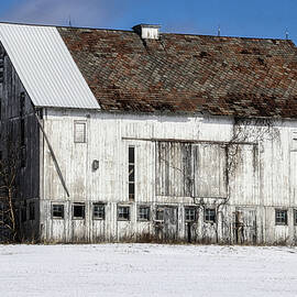 Old Barn on a Snowy Hill by Jeff Roney