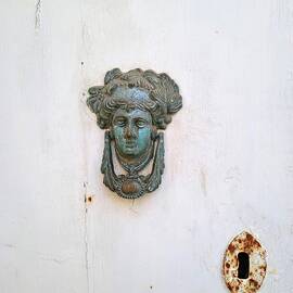 Old brass door knocker by Lucia Waterson