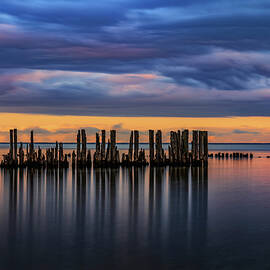 Old Pier Remains In The Sea At Twilight by Artur Bogacki