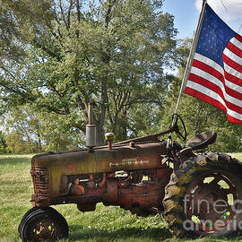 Old Tractor. New Flag by Linda Brittain