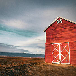 Red barn and dramatic sky by Jeff Swan