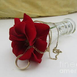 Red Rose And Wedding Ring by Lesley Evered