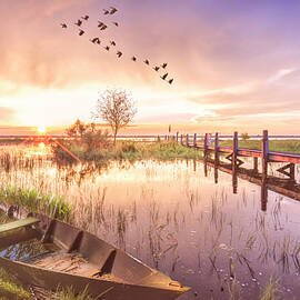 Rowboat in the Marsh in Soft Light at Sunset by Debra and Dave Vanderlaan