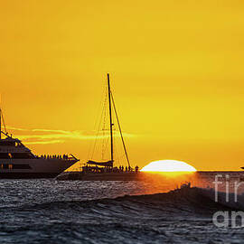 Sailers gather for sunset on the high seas by Phillip Espinasse