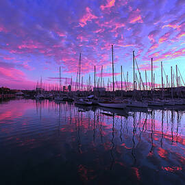 Scenic sunrise at the Port of Barcelona by Lux Argus