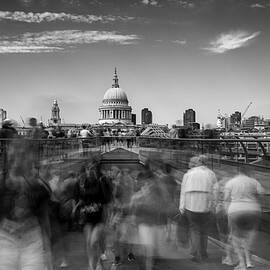 Silhouette of People walking at Millenium Bridge, London England by Michalakis Ppalis