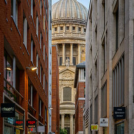 St Paul's cathedral in London seen on a lonely morning at sunrise. by George Afostovremea