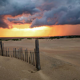 Stormy Horizons Ablaze At Jockey's Ridge State Park by Gregory Ballos