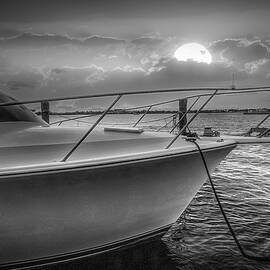 Sun is Setting over the Harbor Black and White by Debra and Dave Vanderlaan
