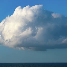 Sunlit Cloud over the Atlantic Ocean in Daytona Beach, Florida by Donna Kaluzniak
