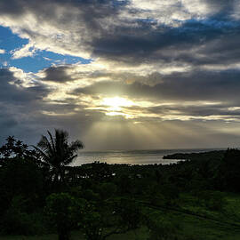 Sunrise off the Philippines  by Bill Rogers
