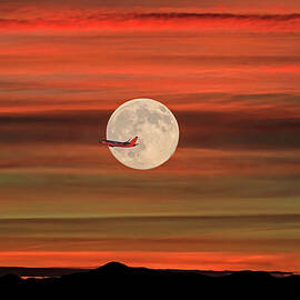 Sunset Flight With Full Moon by Donna Kennedy