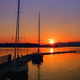 Sunset on Oban Harbor by Olivier Le Queinec