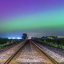 Train track aurora panorama by Caleb McGinn