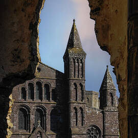 View through window of medieval Bishops Palace frames St Davids Cathedral, Pembrokeshire, Wales, UK by Terence Kerr