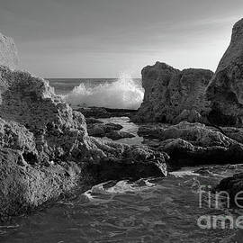 Wave Crushing Rocks in Gale Beach - Monochrome by Angelo DeVal
