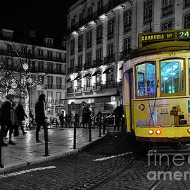 Yellow Electrico at night in Lisbon by Angelo DeVal