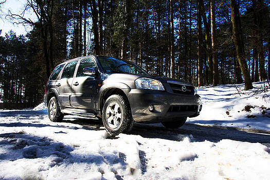 Newnow Photography By Vera Cepic - Right front side of Mazda Tribute on the mountain road Newnow Photography By Vera Cepic - Right front side of Mazda Tribute on the mountain road