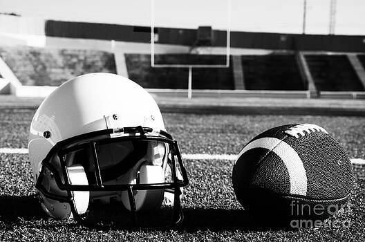 Danny Hooks - American Football and Helmet on Field Danny Hooks - American Football and Helmet on Field