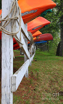 Michael Mooney - Kayaks on a fence Michael Mooney - Kayaks on a fence