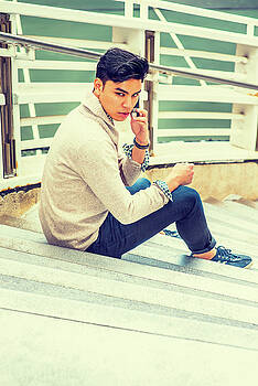 Alexander Image - Young Asian American Man talking on cell phone outside in New Yo Alexander Image - Young Asian American Man talking on cell phone outside in New Yo